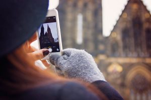 woman taking a photo with her smartphone